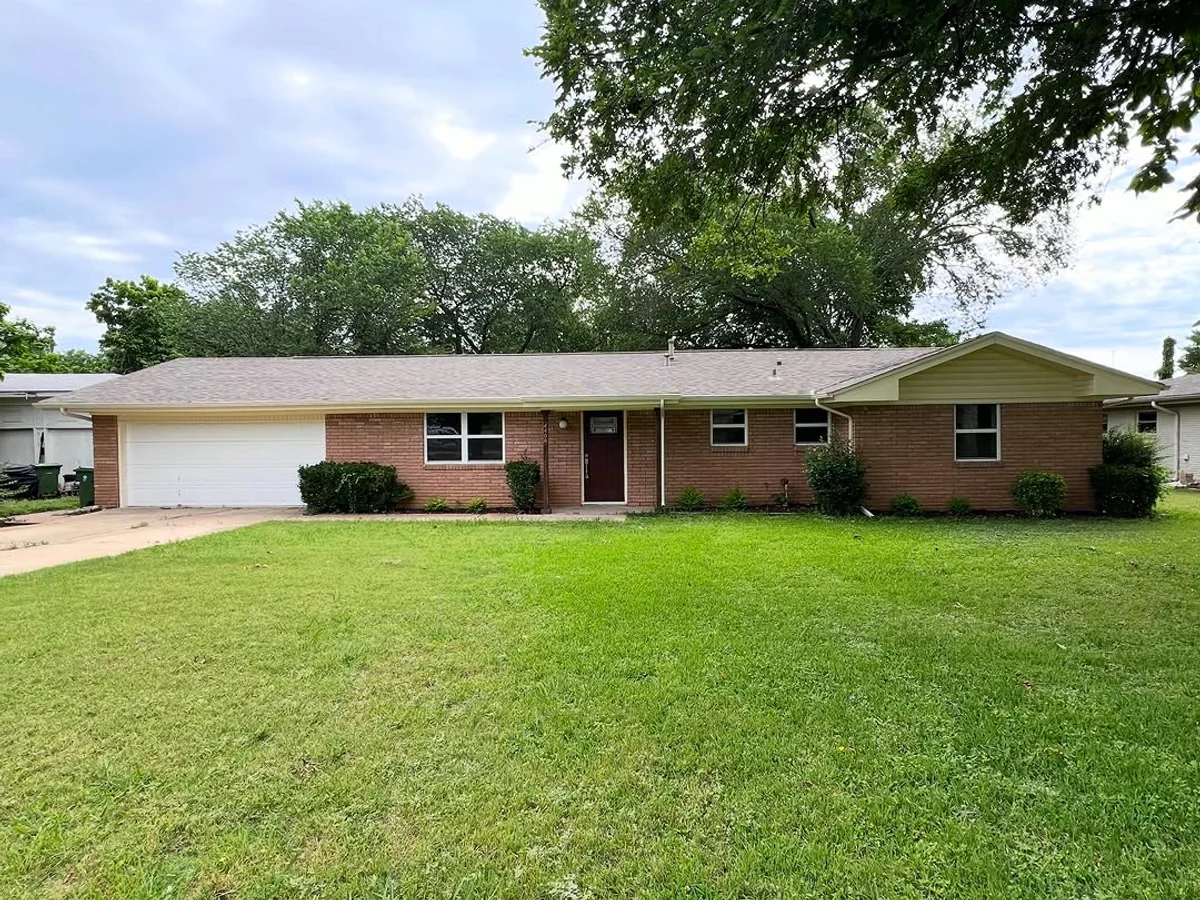 Single story Dallas-Fort Worth home with repainted fascia, soffits, and entry door